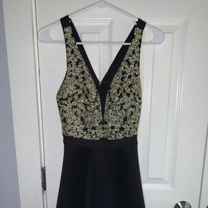 Gold beaded black skater mini dress with mesh back